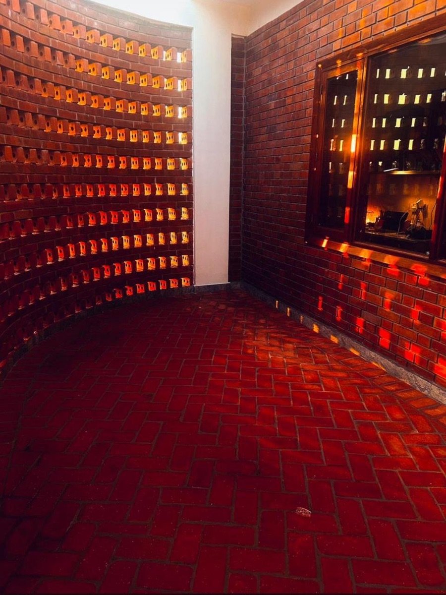 Curved interior wall in exposed wire-cut brick